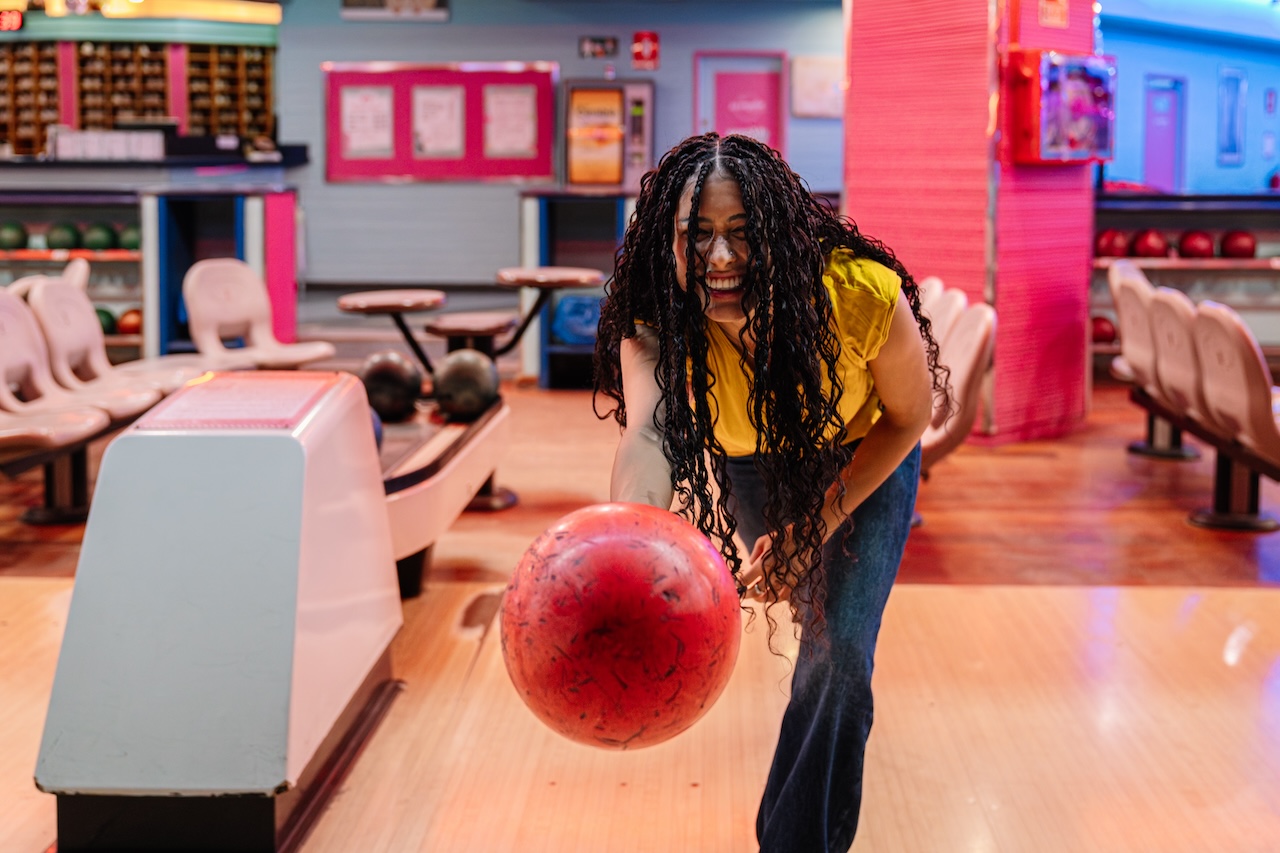 Bowling player stepping up to the lane with ball in hand