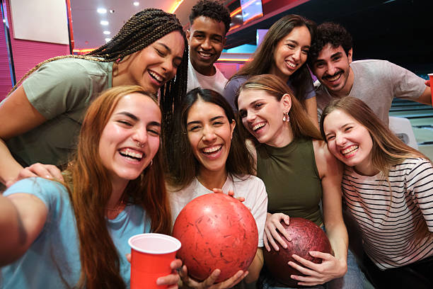 Group celebrating in bowling lounge area